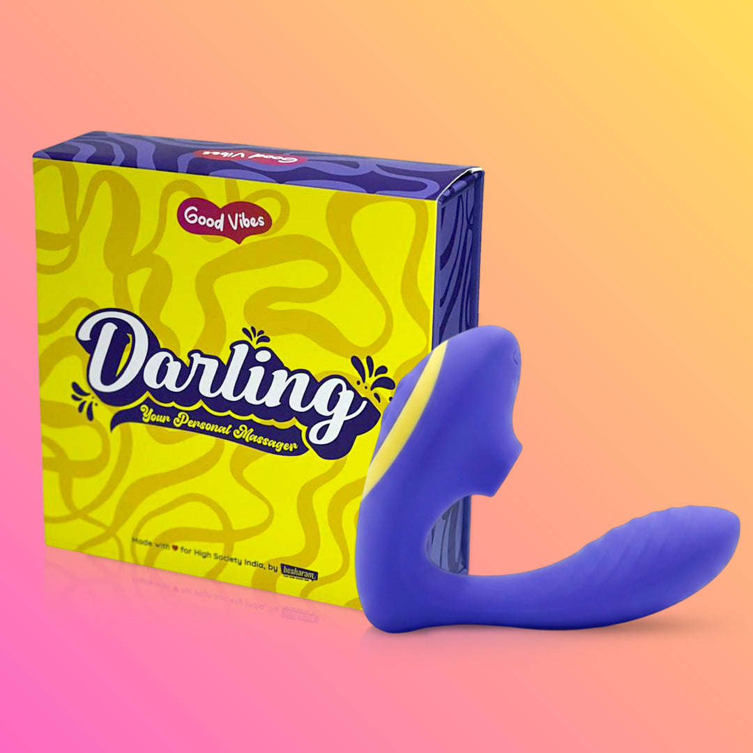 Purple toy with 'Good Vibes Darling' packaging on a gradient background